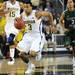 Michigan sophomore Trey Burke moves the ball down the court during the second half of an NIT Season Tip-Off game at Crisler Center on Tuesday. Melanie Maxwell I AnnArbor.com